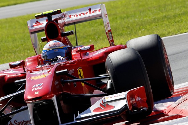 Ferrari F1 driver Alonso of Spain takes a curve during the second practice session of the Italian F1 Grand Prix at the Monza circuit