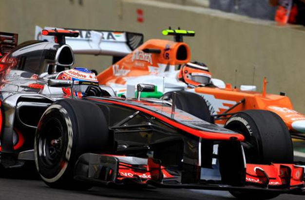 Button y Hulkenberg. GP Brasil 2012