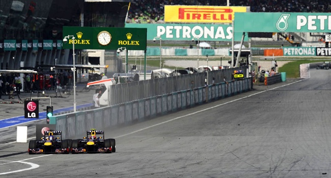 Vettel y Webber durante el GP de Malasia 2013