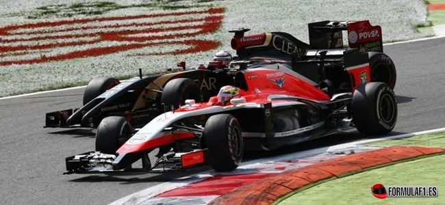 Jules Bianchi (FRA) Marussia F1 Team MR03 leads Romain Grosjean (FRA) Lotus F1 E22.